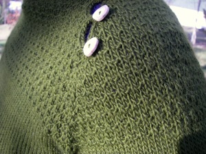 Green sweater shoulder detail